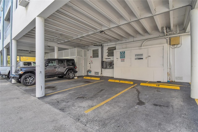 view of car parking with a parking deck