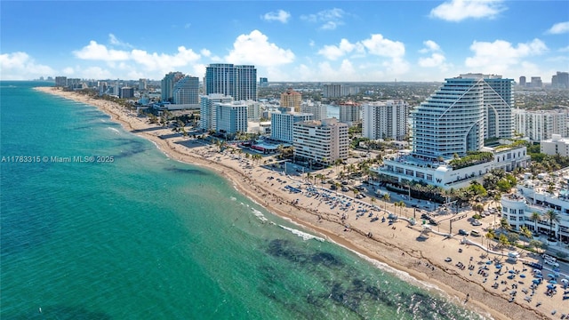 aerial view featuring a water view, a view of city, and a view of the beach
