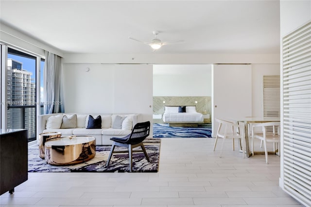 living area featuring ceiling fan