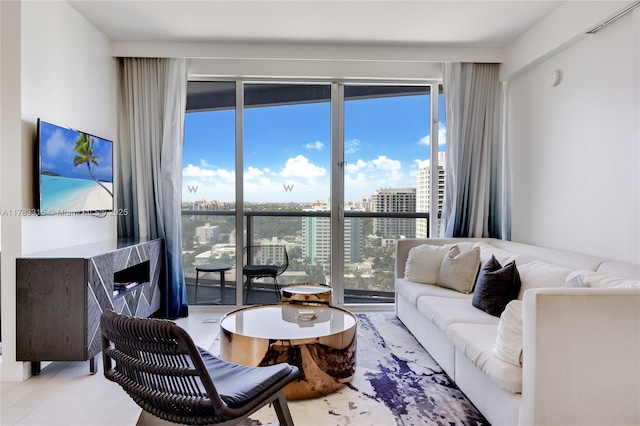 living area featuring a view of city and wood finished floors