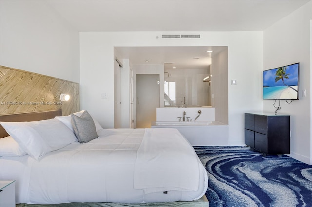bedroom featuring baseboards and visible vents