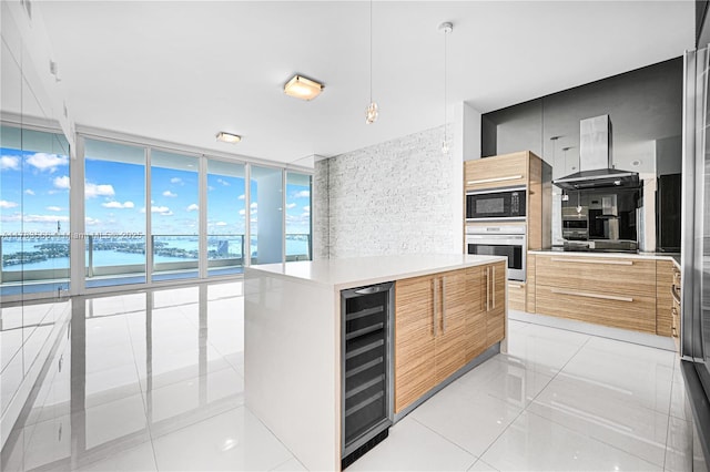 kitchen featuring black microwave, modern cabinets, wine cooler, a water view, and oven