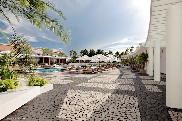 community pool with a patio area