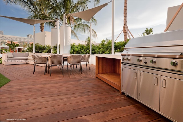 wooden deck with an outdoor living space and outdoor dining area