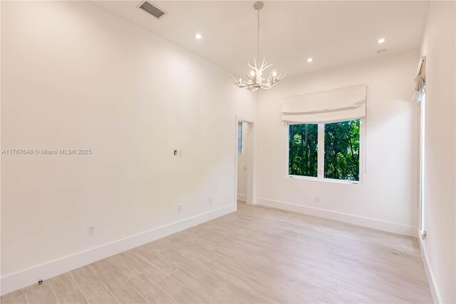8200 SW 62nd Ave, Miami, FL 33143 - spare room featuring visible vents, baseboards, a notable chandelier, light wood-style floors, and recessed lighting