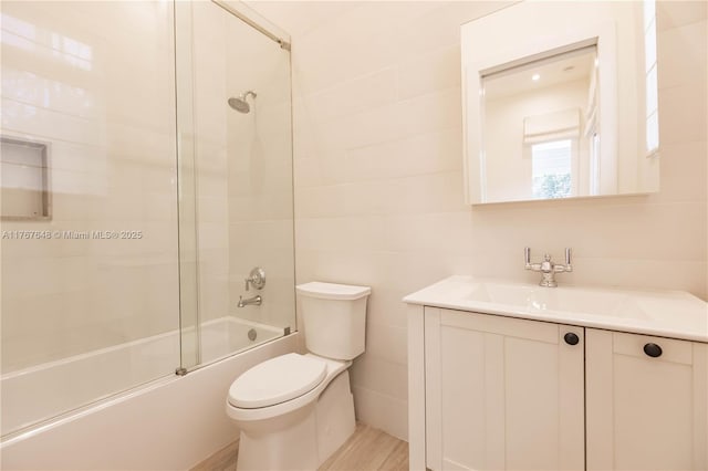 8200 SW 62nd Ave, Miami, FL 33143 - bathroom with shower / bath combination with glass door, vanity, toilet, tile walls, and wood finished floors