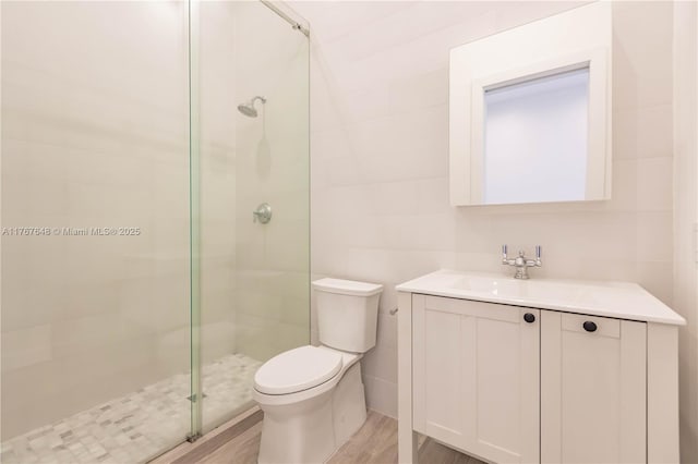 8200 SW 62nd Ave, Miami, FL 33143 - full bath with tile walls, a stall shower, wood finished floors, vanity, and toilet