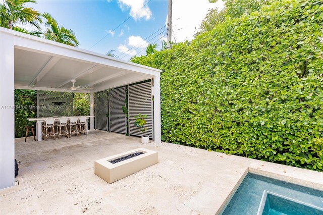 8200 SW 62nd Ave, Miami, FL 33143 - view of patio / terrace featuring ceiling fan, an in ground hot tub, exterior bar, and an outdoor fire pit