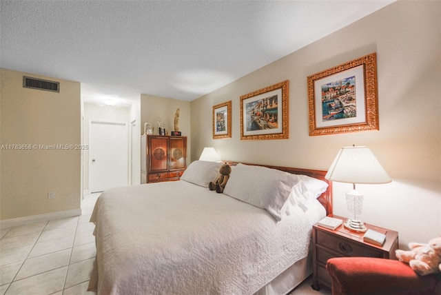 1950 S Ocean Dr Unit 17E, Hallandale Beach, FL 33009 - bedroom with a textured ceiling, light tile patterned floors, baseboards, and visible vents