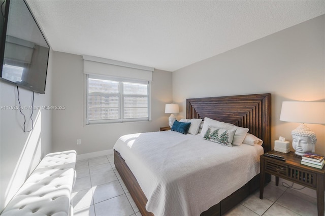 1950 S Ocean Dr Unit 17E, Hallandale Beach, FL 33009 - bedroom with light tile patterned floors, baseboards, and a textured ceiling