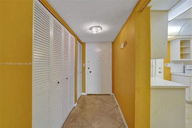 1401 S Ocean Dr Unit 902, Hollywood, FL 33019 - hallway featuring light tile patterned floors and baseboards