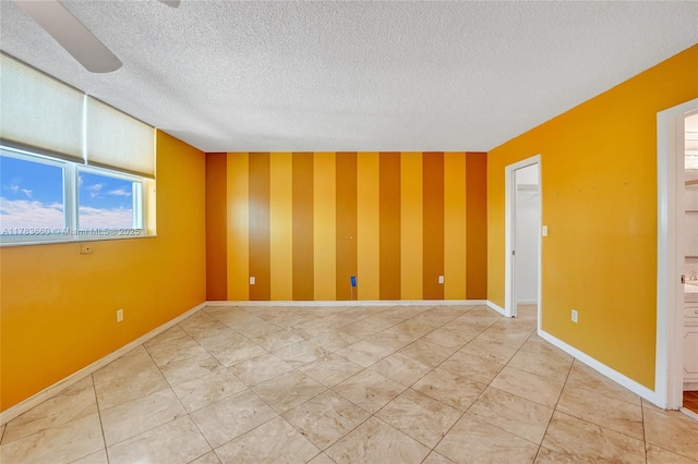 1401 S Ocean Dr Unit 902, Hollywood, FL 33019 - unfurnished room featuring a textured ceiling, baseboards, and wallpapered walls