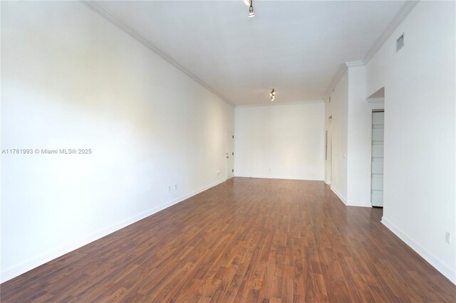 8390 SW 72nd Ave Unit 517, Miami, FL 33143 - spare room with ornamental molding and dark wood-type flooring