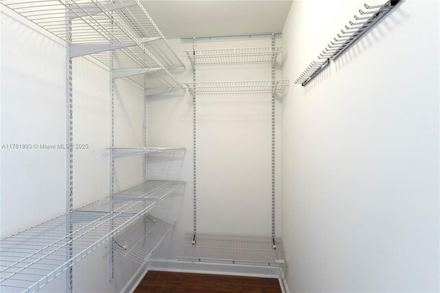 8390 SW 72nd Ave Unit 517, Miami, FL 33143 - walk in closet featuring wood finished floors