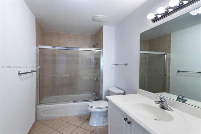 8390 SW 72nd Ave Unit 517, Miami, FL 33143 - full bath featuring tile patterned flooring, vanity, and combined bath / shower with glass door