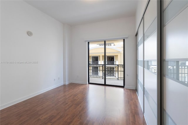 8390 SW 72nd Ave Unit 517, Miami, FL 33143 - empty room with plenty of natural light and wood finished floors