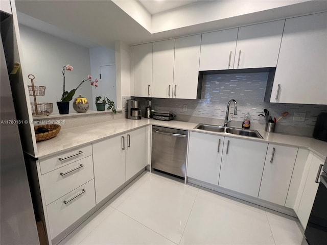 10950 NW 82nd St Unit 420, Doral, FL 33178 - kitchen featuring light tile patterned floors, a sink, light countertops, appliances with stainless steel finishes, and backsplash