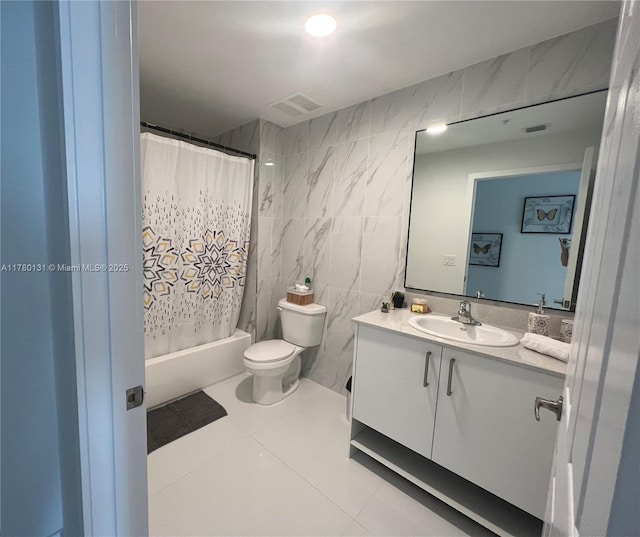 10950 NW 82nd St Unit 420, Doral, FL 33178 - full bathroom with vanity, tile patterned flooring, toilet, visible vents, and tile walls