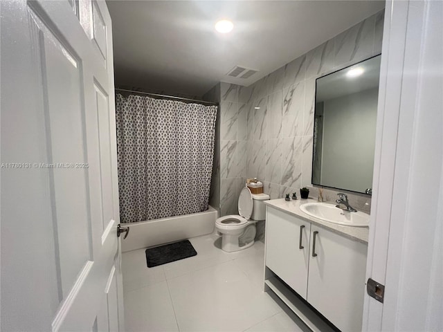 10950 NW 82nd St Unit 420, Doral, FL 33178 - full bath featuring vanity, tile patterned flooring, toilet, visible vents, and tile walls
