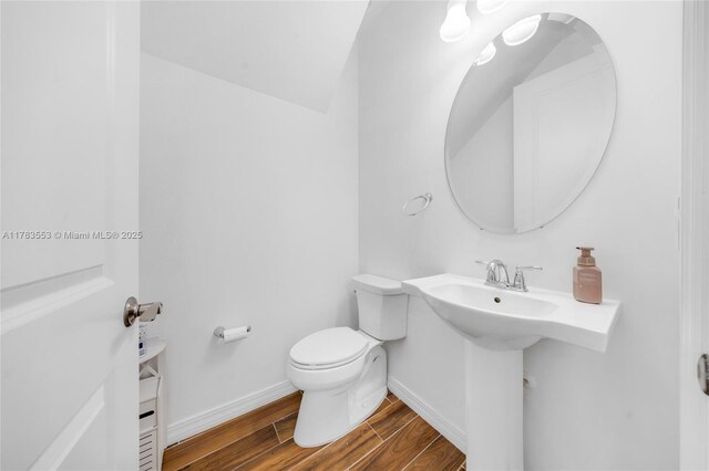1705 Trailhead Ter, Hollywood, FL 33021 - bathroom with toilet, wood finished floors, and baseboards