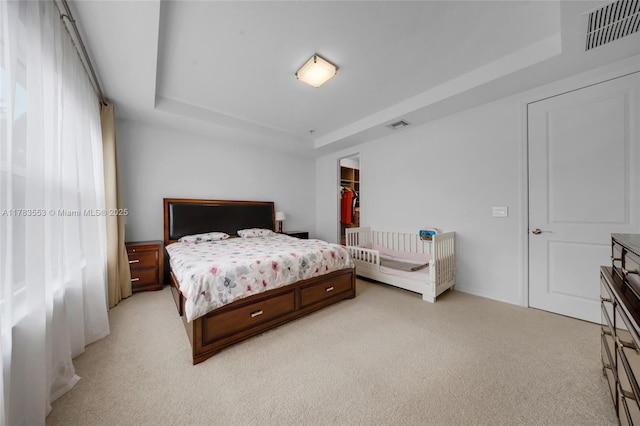 1705 Trailhead Ter, Hollywood, FL 33021 - bedroom featuring visible vents, light colored carpet, and a raised ceiling