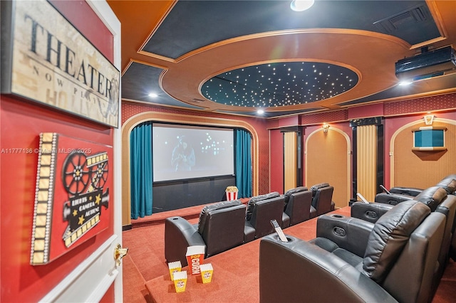 carpeted home theater featuring visible vents