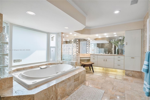 full bath with a jetted tub, recessed lighting, crown molding, and vanity