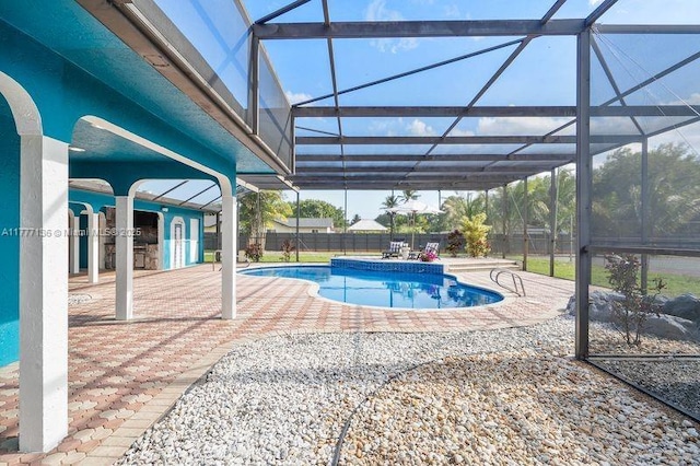 view of swimming pool featuring a patio, a fenced in pool, a fenced backyard, and a lanai