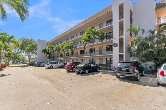 10400 NW 30th Ct Unit 203, Sunrise, FL 33322 - view of property featuring uncovered parking