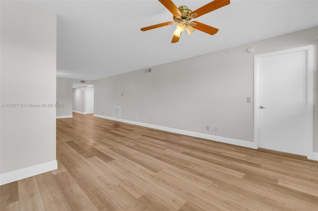 10400 NW 30th Ct Unit 203, Sunrise, FL 33322 - unfurnished room with baseboards, a ceiling fan, light wood finished floors, and visible vents