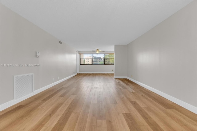 10400 NW 30th Ct Unit 203, Sunrise, FL 33322 - empty room featuring visible vents, light wood-style floors, ceiling fan, and baseboards