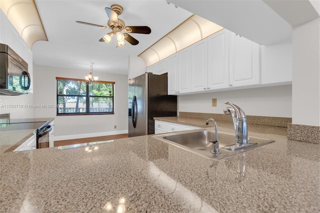 10400 NW 30th Ct Unit 203, Sunrise, FL 33322 - kitchen with white cabinets, a sink, black electric range, ceiling fan with notable chandelier, and fridge with ice dispenser