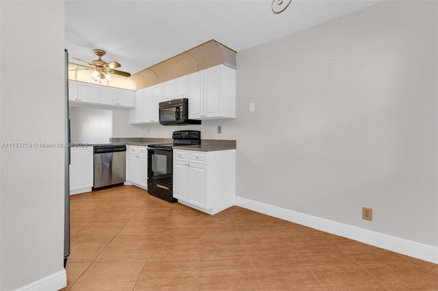 10400 NW 30th Ct Unit 203, Sunrise, FL 33322 - kitchen with dark countertops, baseboards, white cabinets, a ceiling fan, and black appliances