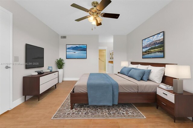 10400 NW 30th Ct Unit 203, Sunrise, FL 33322 - bedroom featuring baseboards, visible vents, ceiling fan, and ensuite bath