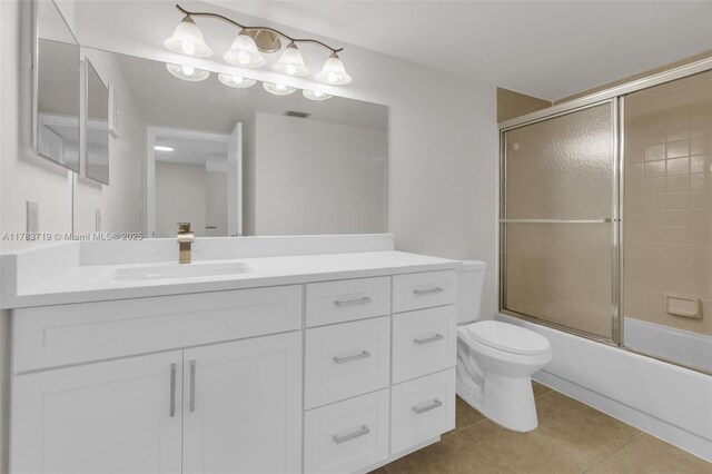 10400 NW 30th Ct Unit 203, Sunrise, FL 33322 - full bathroom featuring vanity, visible vents, shower / bath combination with glass door, toilet, and tile patterned floors