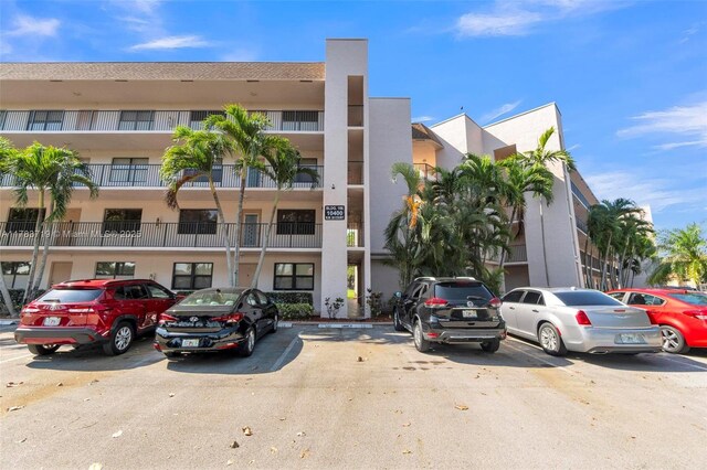 10400 NW 30th Ct Unit 203, Sunrise, FL 33322 - view of building exterior with uncovered parking