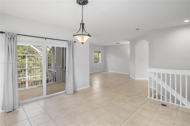 922 NW 127th Ave, Coral Springs, FL 33071 - empty room with light tile patterned floors, arched walkways, and recessed lighting