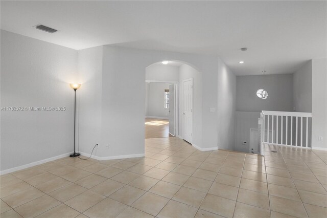 922 NW 127th Ave, Coral Springs, FL 33071 - unfurnished room featuring arched walkways, light tile patterned flooring, and recessed lighting
