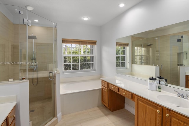 922 NW 127th Ave, Coral Springs, FL 33071 - full bathroom featuring vanity, a bath, a stall shower, tile patterned flooring, and recessed lighting
