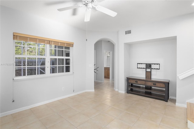 922 NW 127th Ave, Coral Springs, FL 33071 - unfurnished room with arched walkways, light tile patterned floors, and ceiling fan