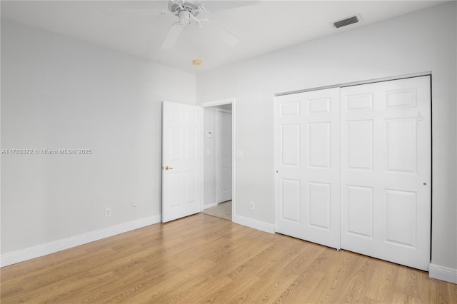 922 NW 127th Ave, Coral Springs, FL 33071 - unfurnished bedroom with light wood-type flooring, a closet, and a ceiling fan
