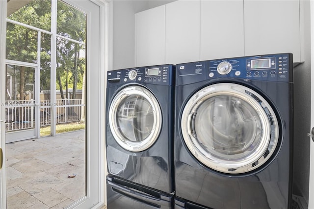 922 NW 127th Ave, Coral Springs, FL 33071 - laundry area with independent washer and dryer and stone tile floors