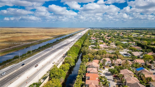 922 NW 127th Ave, Coral Springs, FL 33071 - aerial view of residential area with a major roadway and a nearby body of water