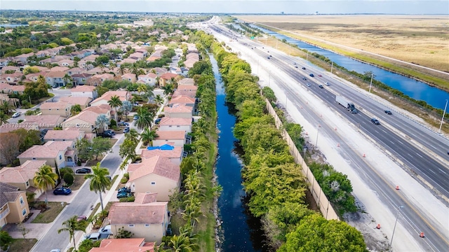 922 NW 127th Ave, Coral Springs, FL 33071 - aerial perspective of suburban area with a main thoroughfare and a large body of water