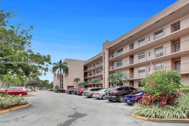 10451 Sunrise Lakes Blvd Unit 401, Sunrise, FL 33322 - view of property featuring uncovered parking