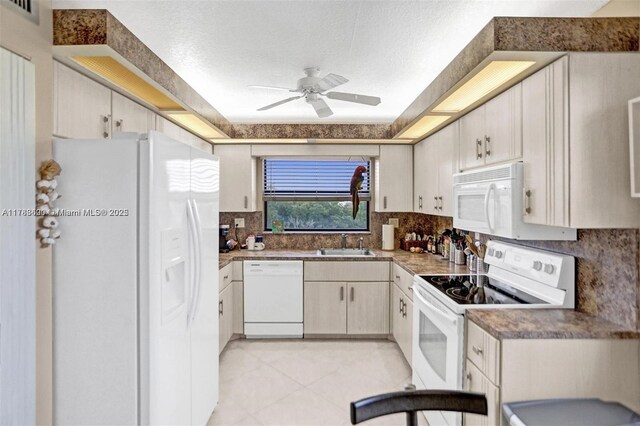 10451 Sunrise Lakes Blvd Unit 401, Sunrise, FL 33322 - kitchen featuring ceiling fan, white appliances, visible vents, a sink, and decorative backsplash