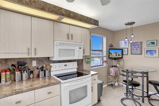 10451 Sunrise Lakes Blvd Unit 401, Sunrise, FL 33322 - kitchen featuring baseboards, white appliances, light tile patterned floors, decorative backsplash, and pendant lighting