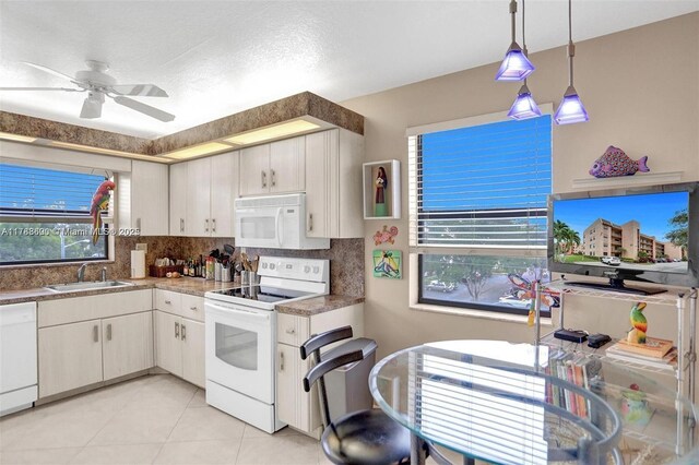 10451 Sunrise Lakes Blvd Unit 401, Sunrise, FL 33322 - kitchen with white appliances, a ceiling fan, a sink, decorative light fixtures, and decorative backsplash