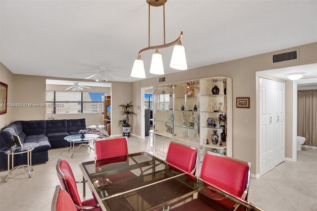 10451 Sunrise Lakes Blvd Unit 401, Sunrise, FL 33322 - dining area featuring baseboards, a ceiling fan, and visible vents