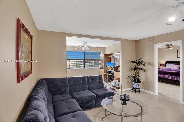 10451 Sunrise Lakes Blvd Unit 401, Sunrise, FL 33322 - living room with baseboards and a ceiling fan